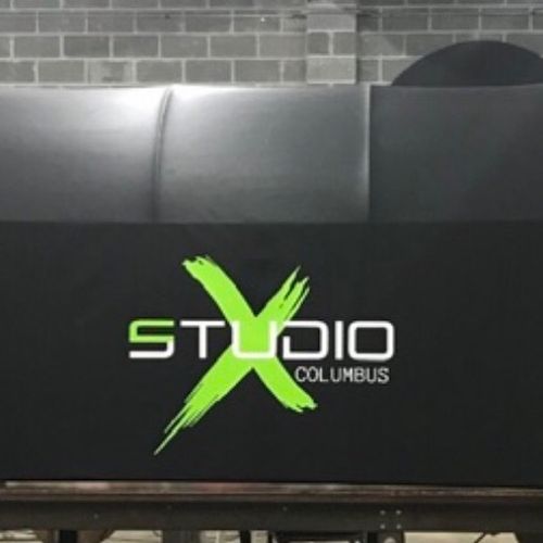 A finished awning that reads 'Studio X Columbus'