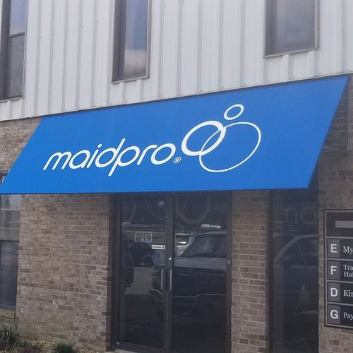 A commercial dooway awning reads 'maidpro'