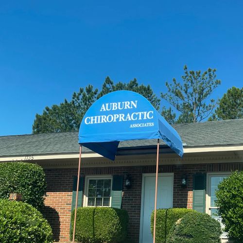 A tall walkway awning reads Auburn Chiropractic Associates