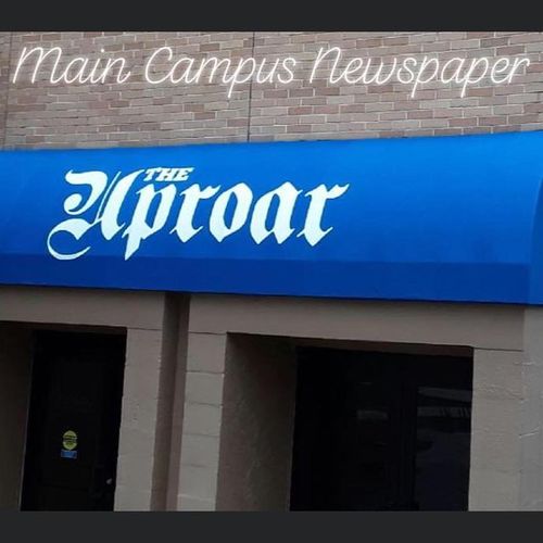 A storefront awning spans the entrance to The Uproar building at Columbus State University
