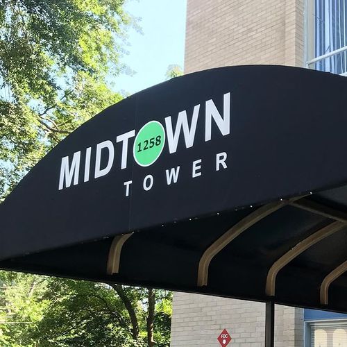 A walkway awning reads 'Midtown Tower'. The 'O' in 'Midtown' contains the number 1258.